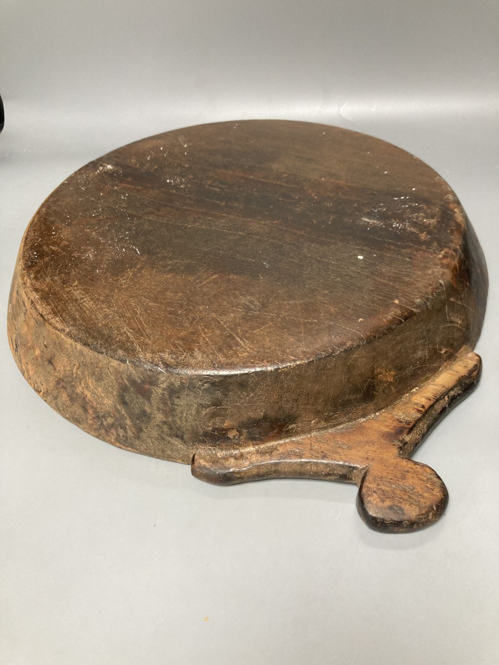 A carved elm two handled serving dish, carved from the solid, 42cm